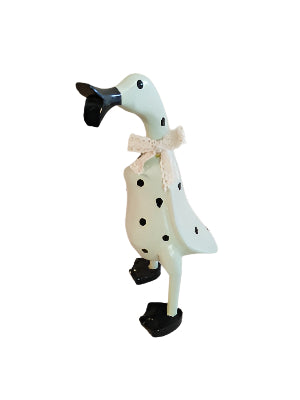 A Wooden Coloured Chatter Duck White With Black Polka Dots Injured