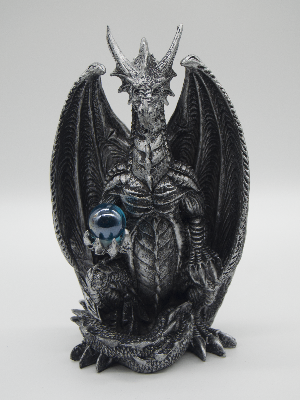 Silver Dragon Holding A Blue Orb